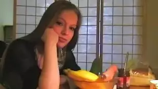 Stretching pussy with food insertions